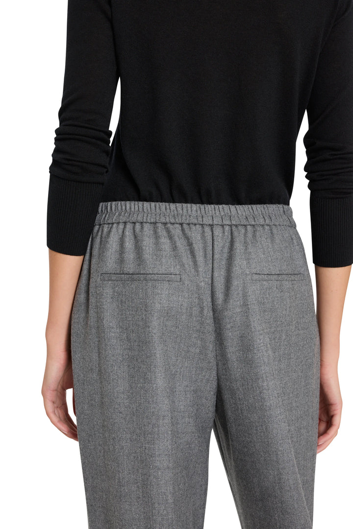 Wide-leg gray flannel pant with elastic waist and pull-on design, back view on model.