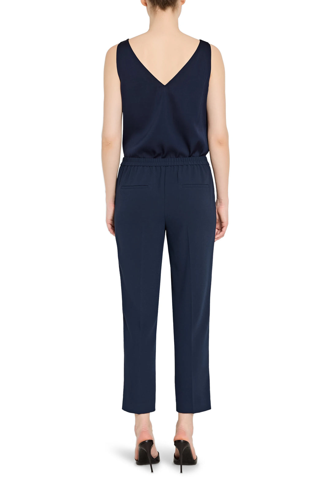 Slim, ankle-length crepe pant with pull-on waistband and clean lines, straight silhouette; back view on model.