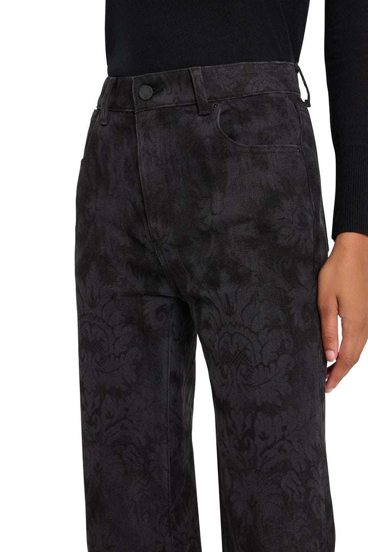Wide-leg flare jean with allover printed fabric, fitted through hips and thighs; front view on model.
