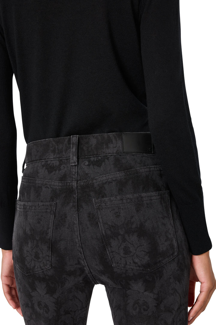 Flare jean with fitted waist, flared leg, and allover print. Back view on model.