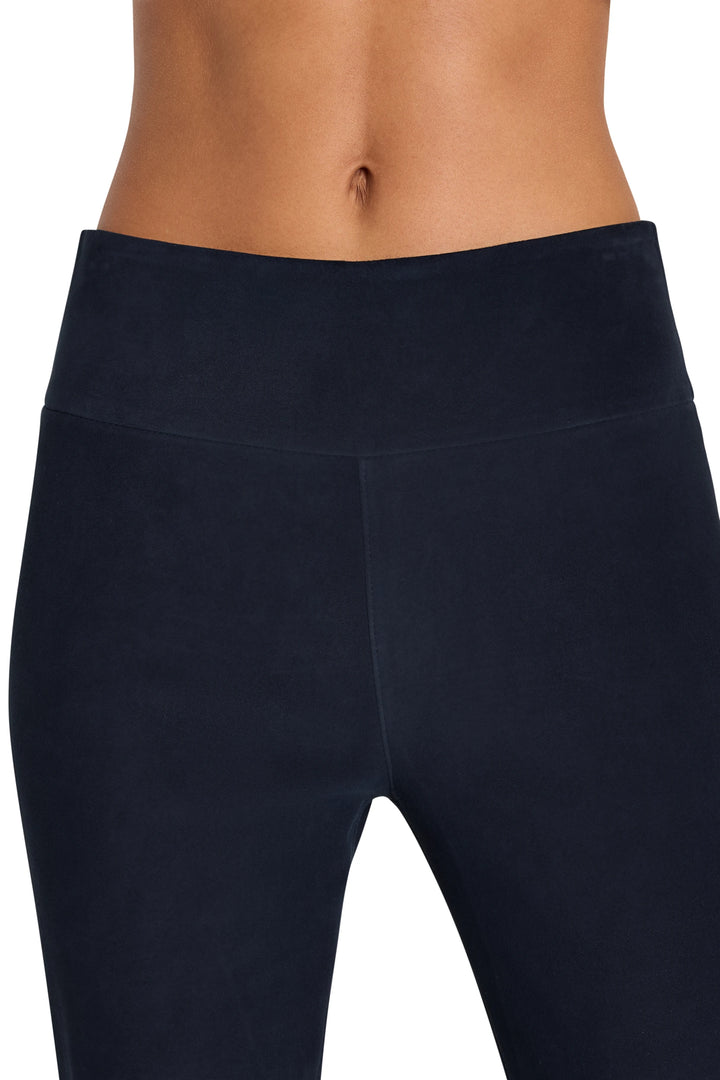 High-waisted, straight-leg suede pant with smooth finish and minimal seams; front view on model.