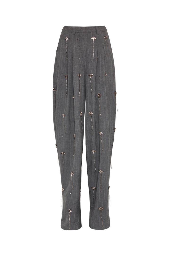 Barrel-leg pant with subtle pleats, small floral embellishments, structured construction; front view on white.