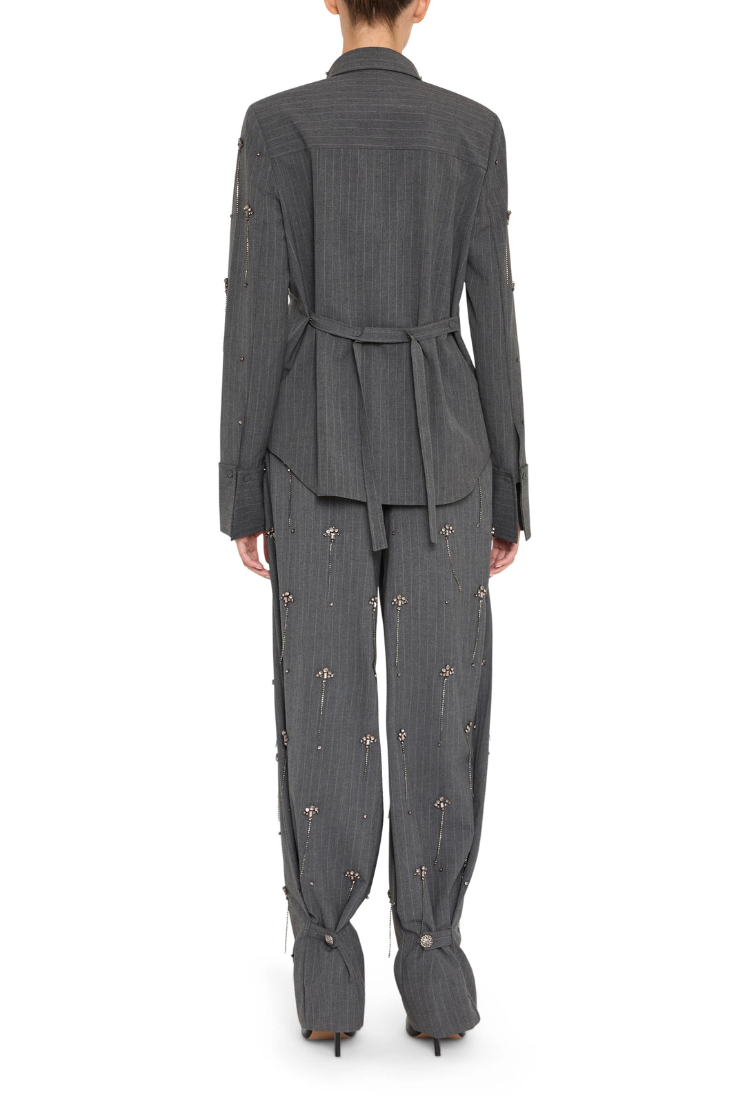 Barrel-leg silhouette pant with floral embroidery, darted yoke, crafted in fabric; back view on model.