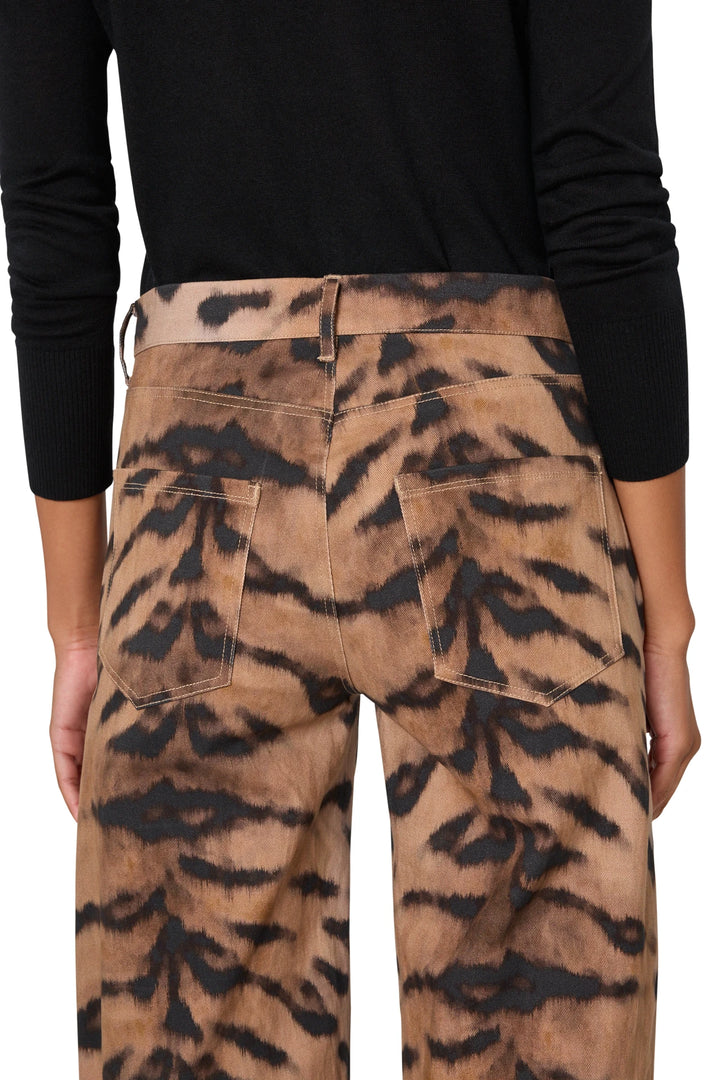 Tapered barrel silhouette denim pant with animal print, structured construction. Back view on model.