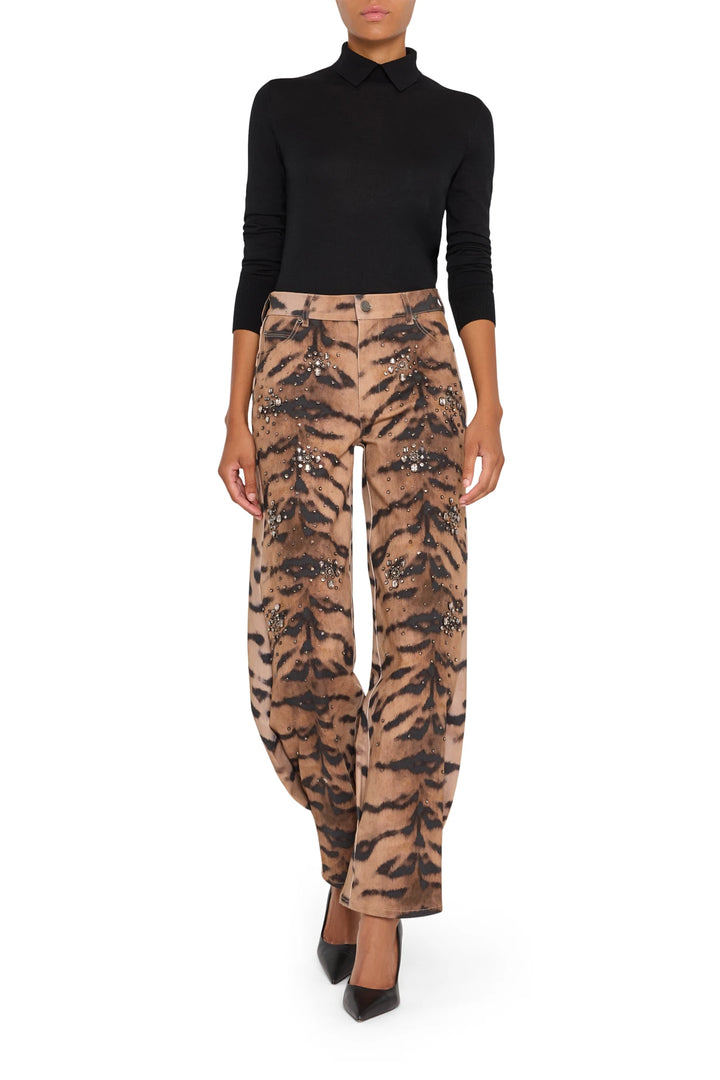 Wide-leg denim pant with animal print and embellished tiger motif, structured waistband, front view on white.