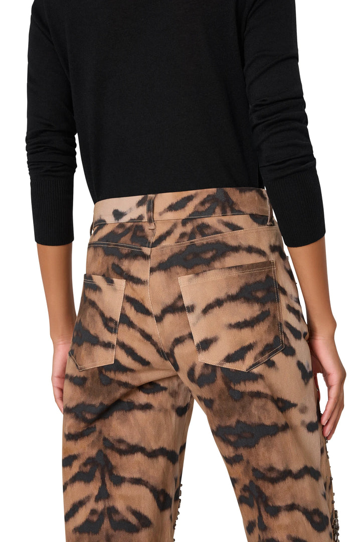 Wide-leg denim pant with tiger motif embellishment and classic five-pocket construction, back view on model.