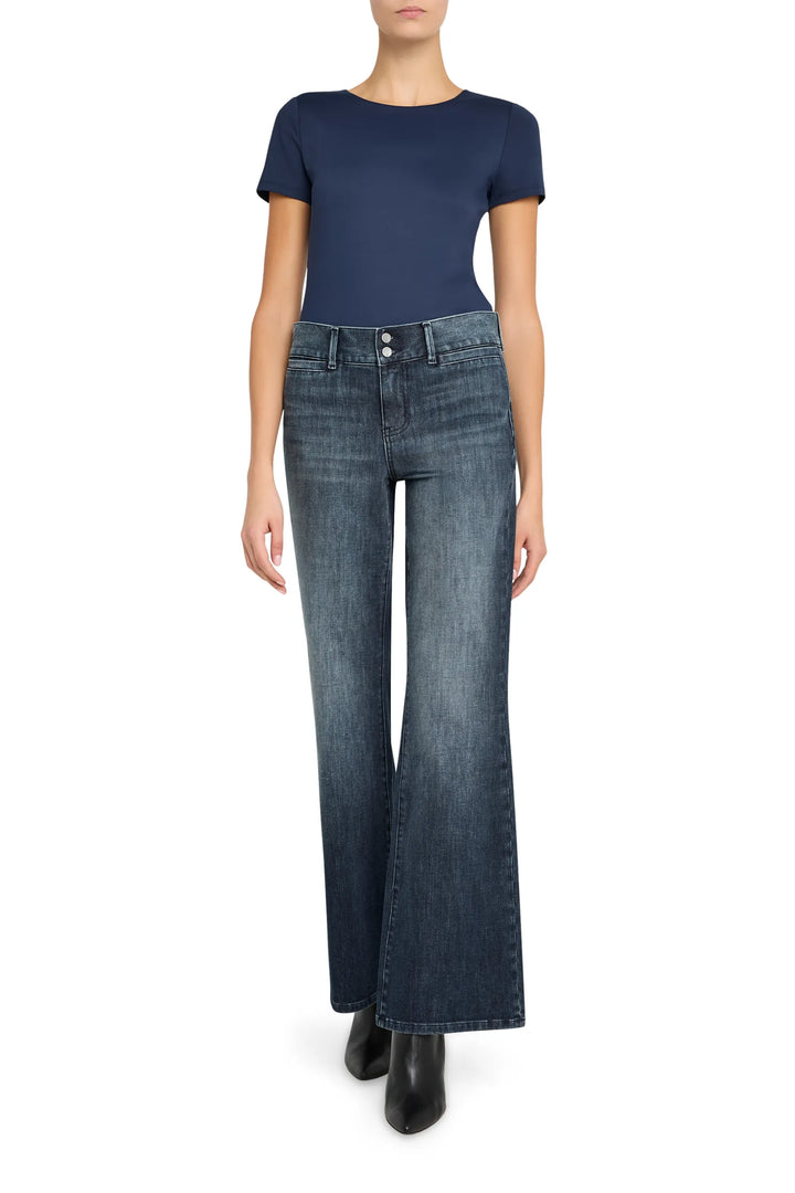 Tailored wide-leg denim Lulu Jean with structured waistband and five-pocket design. Front view on model.