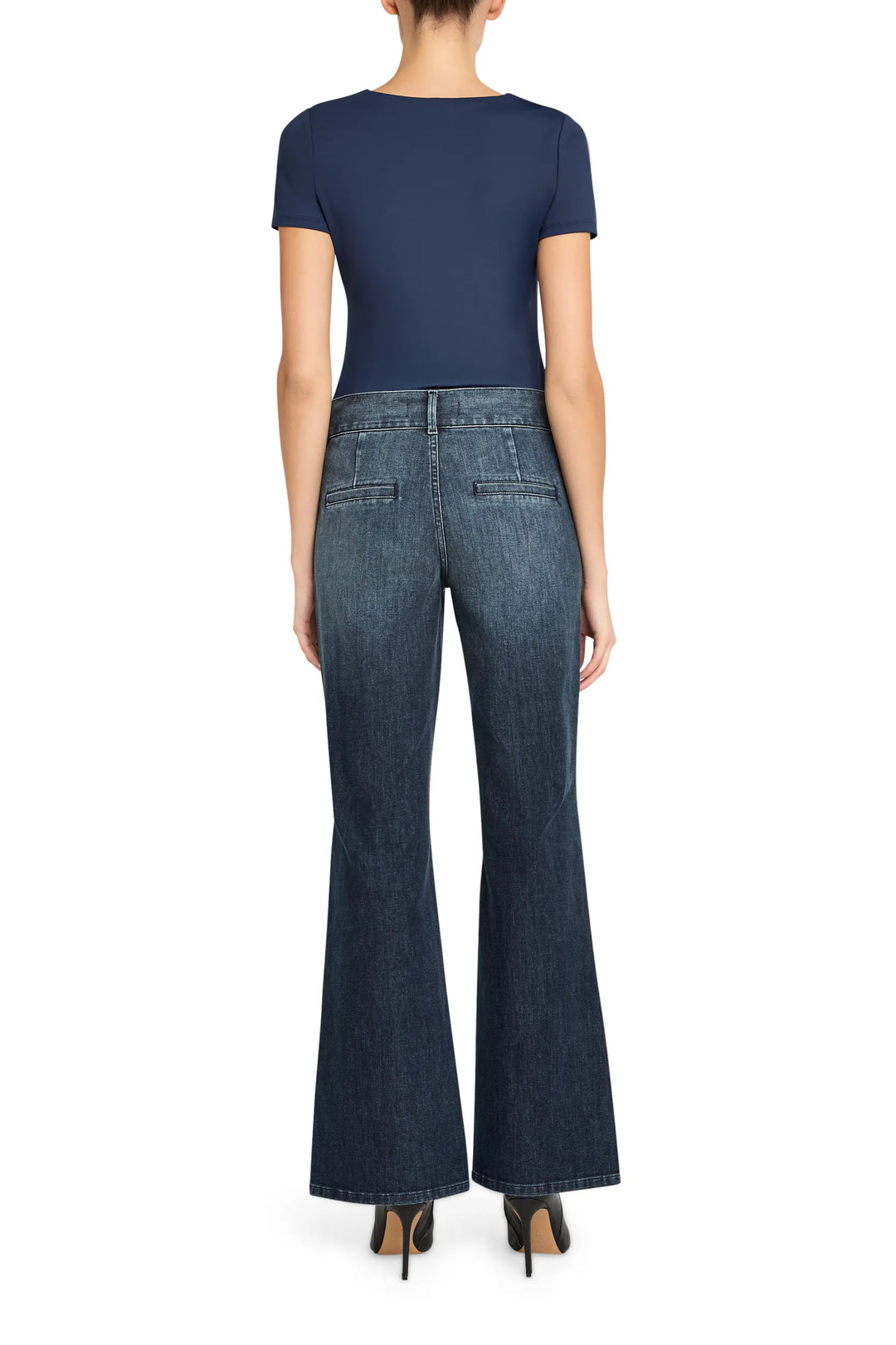 Tailored dark indigo denim jeans with classic straight-leg silhouette, defined waistband; back view on model.