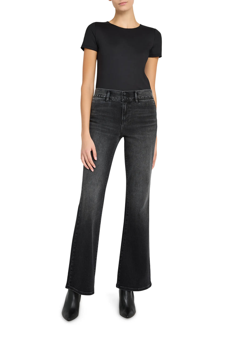 High-rise, slim-fit dark indigo denim with classic five-pocket construction, belt loops. Front view on white.