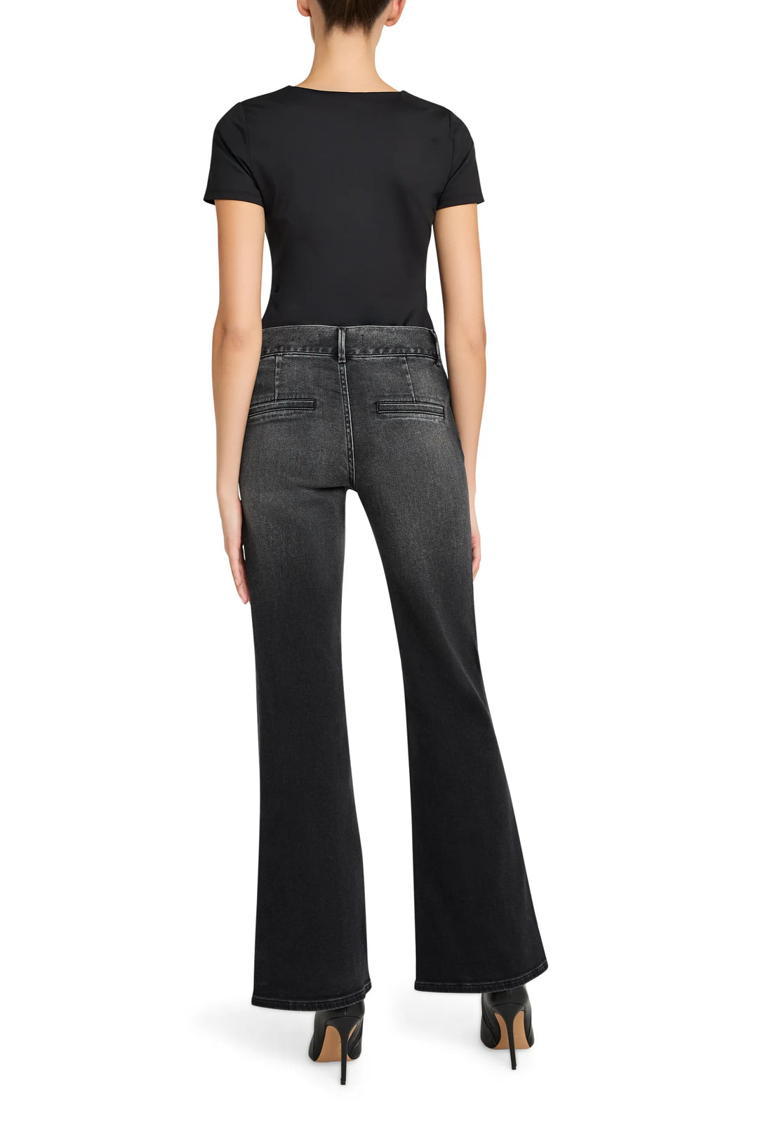 High-rise wide-leg denim trousers in dark indigo cotton with classic five-pocket construction, back view on model.