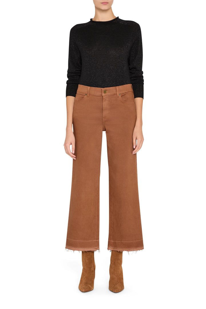 Cropped coated jeans with slim silhouette and classic five-pocket construction, front view on model.