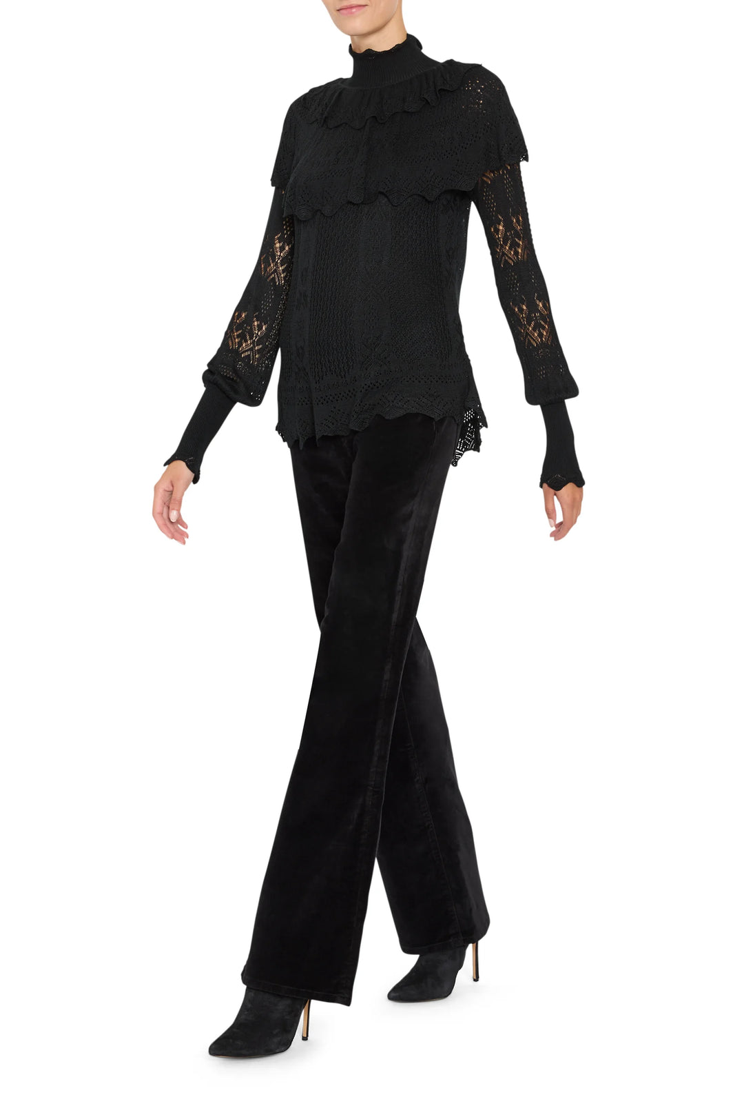 Justina Ruffle Sweater in black with ruffled yoke and lace-inspired stitching, front view on model.