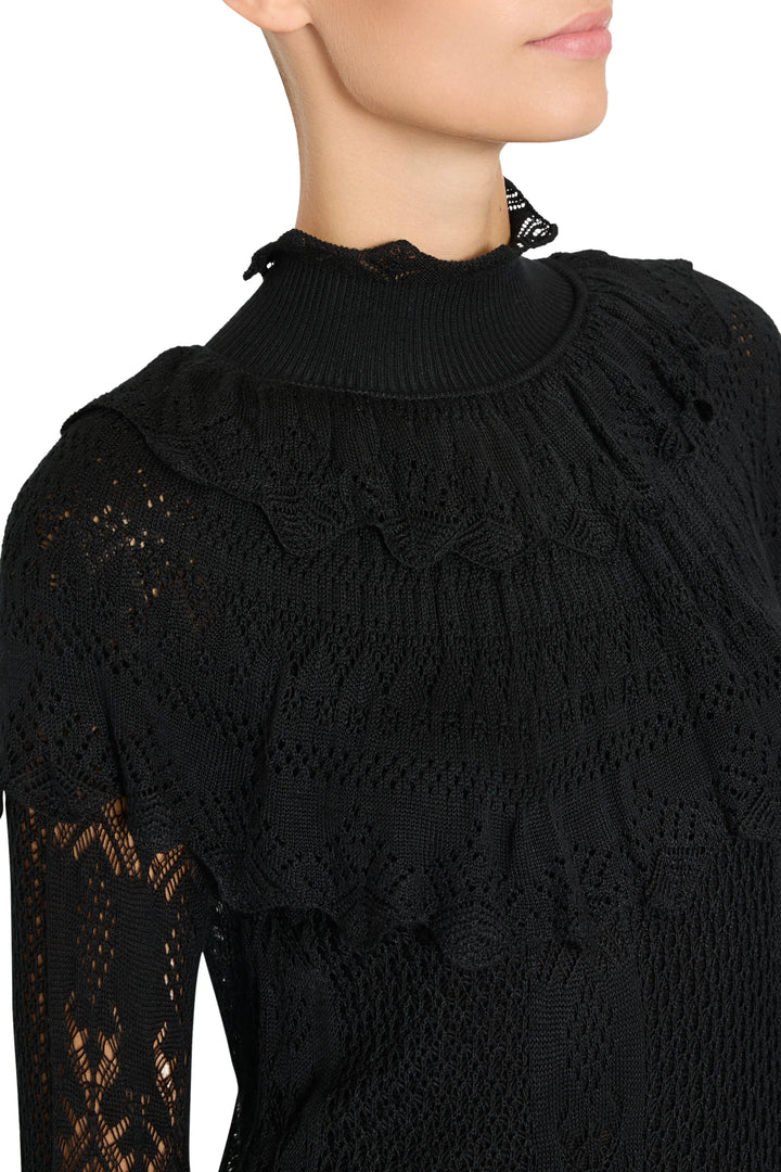 Black Justina Ruffle Sweater with high lace-inspired collar and ruffled yoke, detail view.