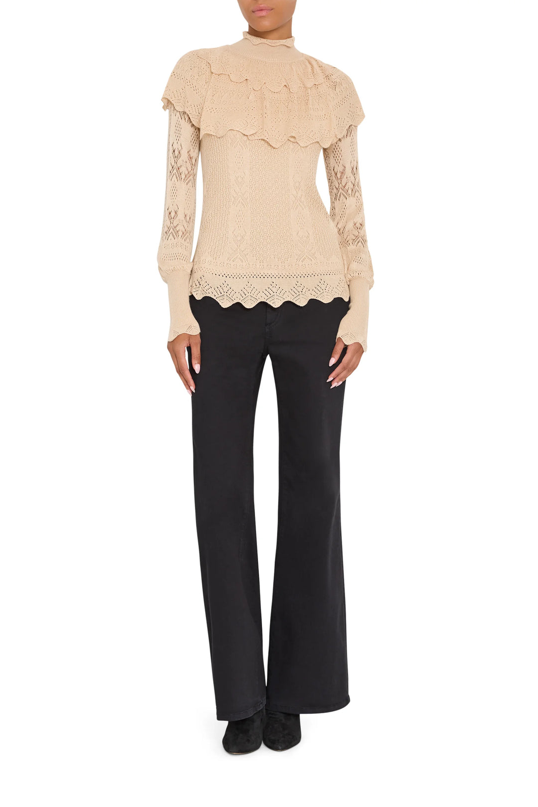 Justina Ruffle Sweater with a tiered ruffle collar and pointelle sleeves, editorial setting.