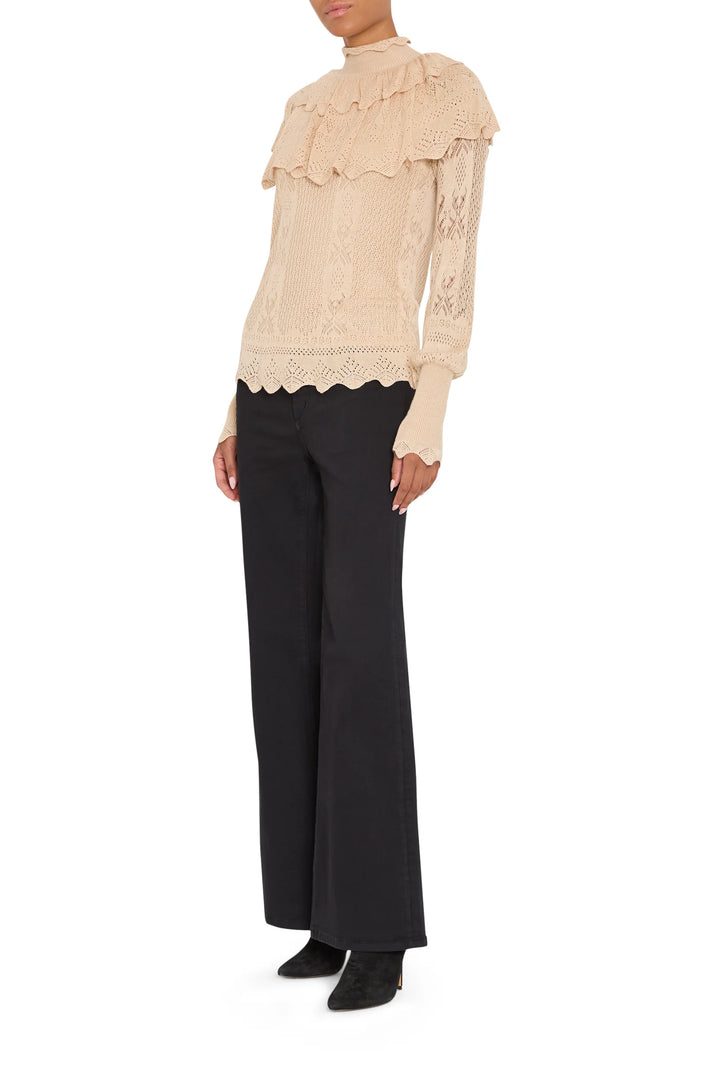 Beige Justina Ruffle Sweater with crochet-knit texture, ruffled collar, and Victorian-style long sleeves, front view.
