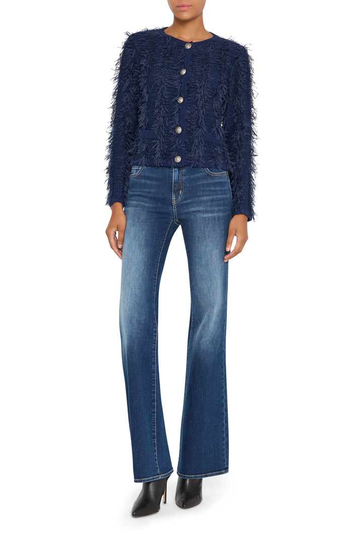 Relaxed fit cardigan with fringe trim, open front, ribbed cuffs and hem; front view on white.