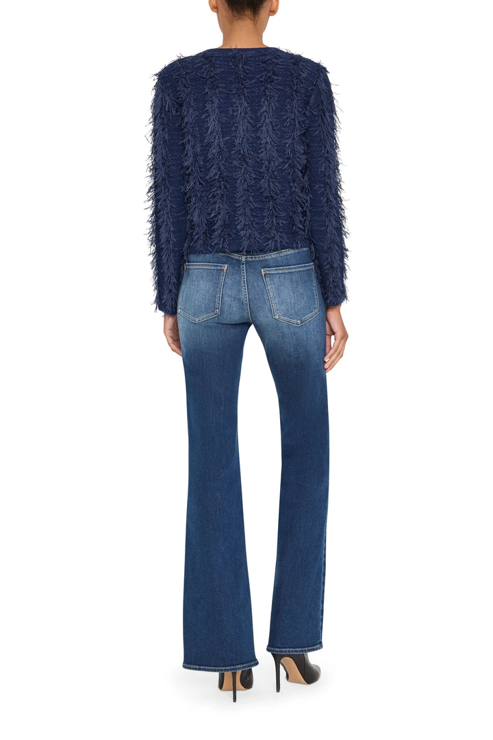 Long sleeve cardigan with fringe trim, open front, soft knit fabric; back view on model.
