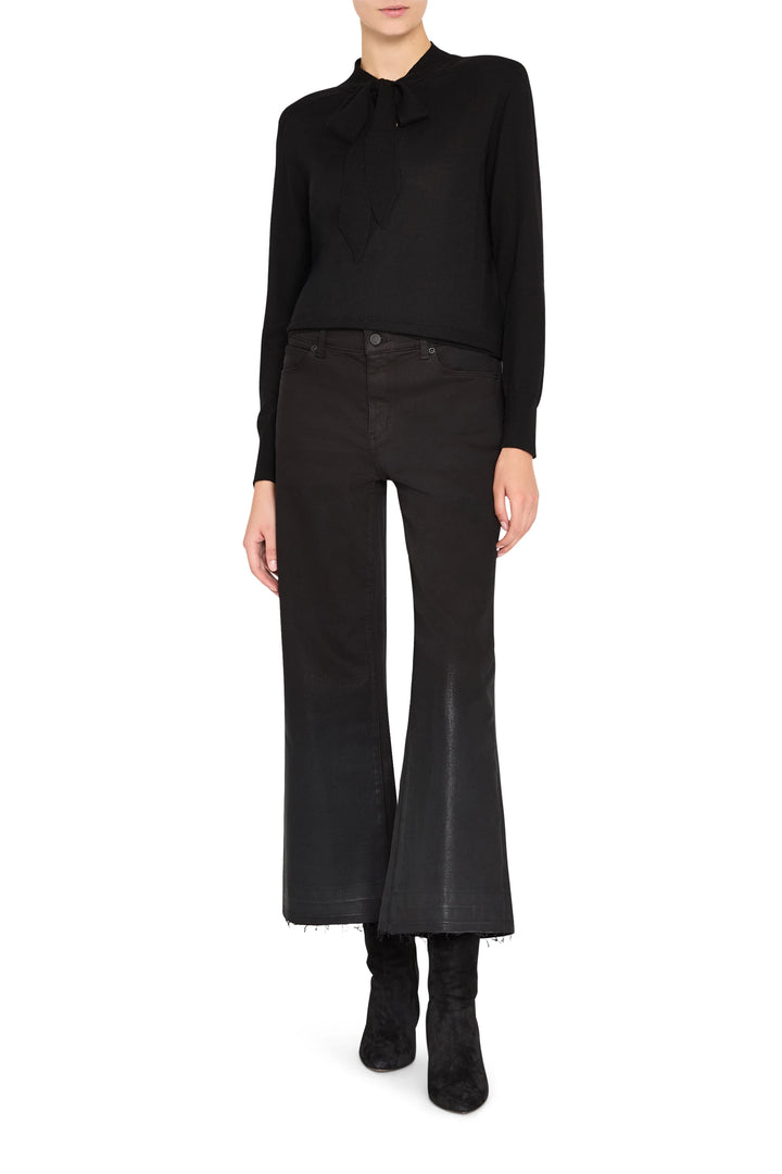 Relaxed-fit sweater with tie neckline and soft knit fabric, long sleeves—front view on model.