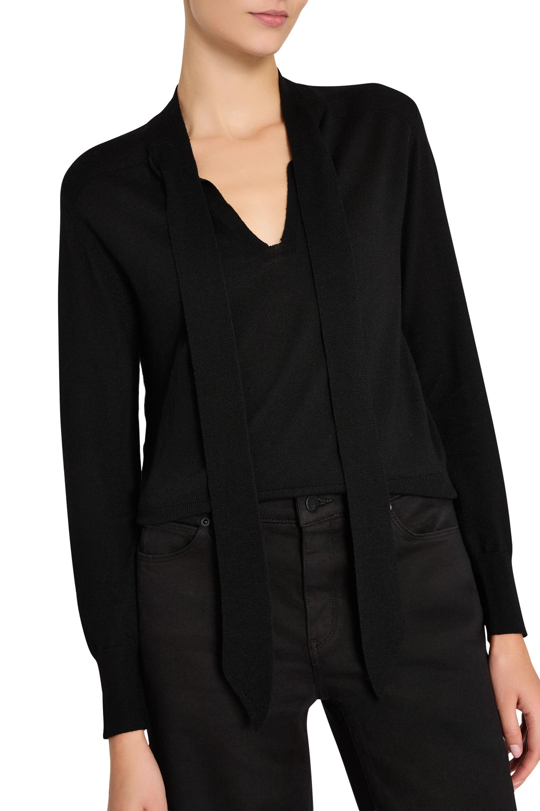 Relaxed-fit sweater with tie neckline, ribbed cuffs, and soft knit construction; front view on model.