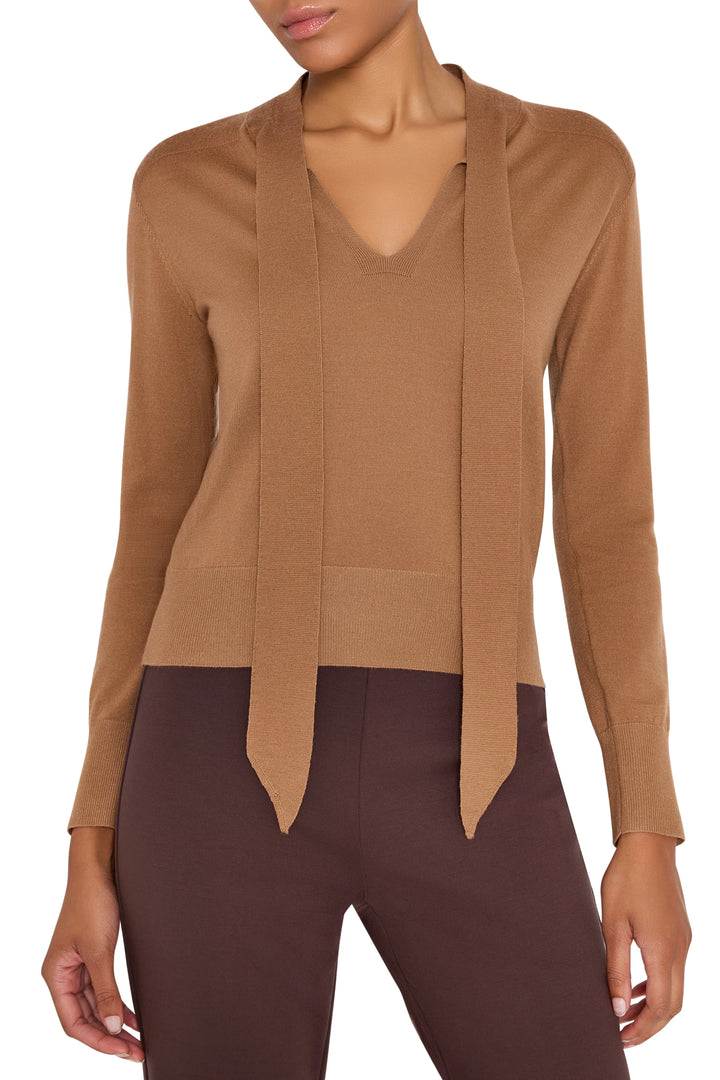 Relaxed-fit sweater with tie neckline, soft knit fabric, long sleeves. Front view on model.