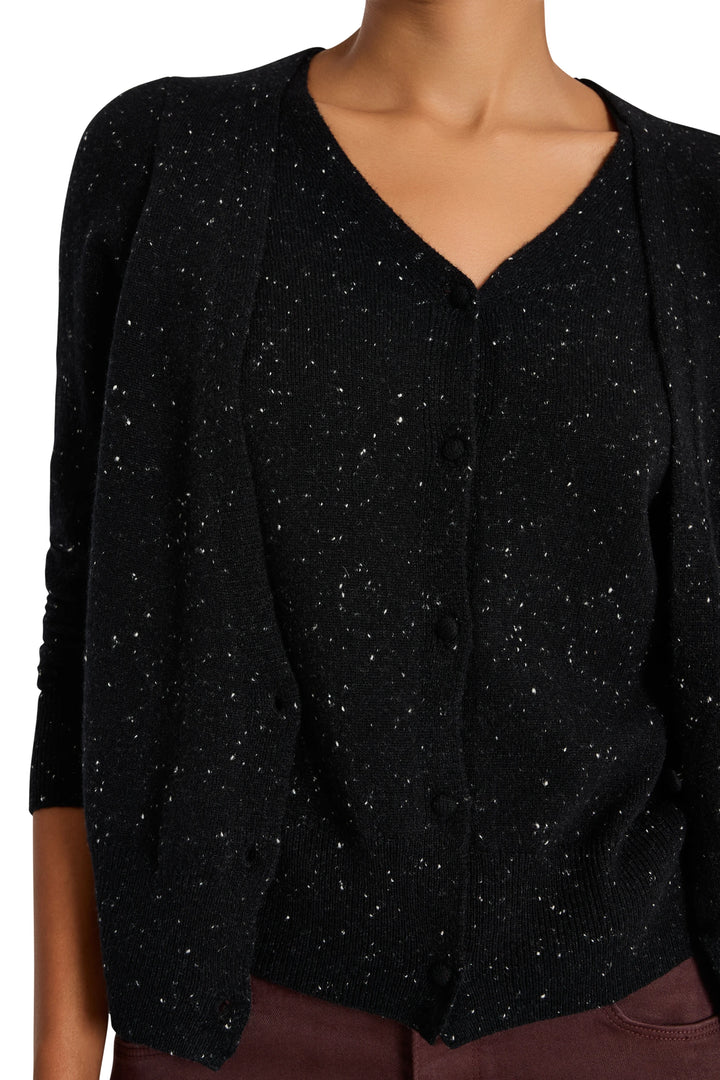 V-neck cashmere cardigan with double layer, button front, slim fit silhouette. Front view on model.