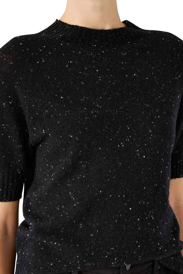 Crew neck cashmere sweater with ribbed collar and cuffs, speckled knit. Front view on model.