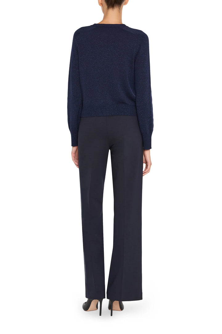 Relaxed-fit dark blue cardigan with open front, long sleeves, and ribbed hem; back view on white.