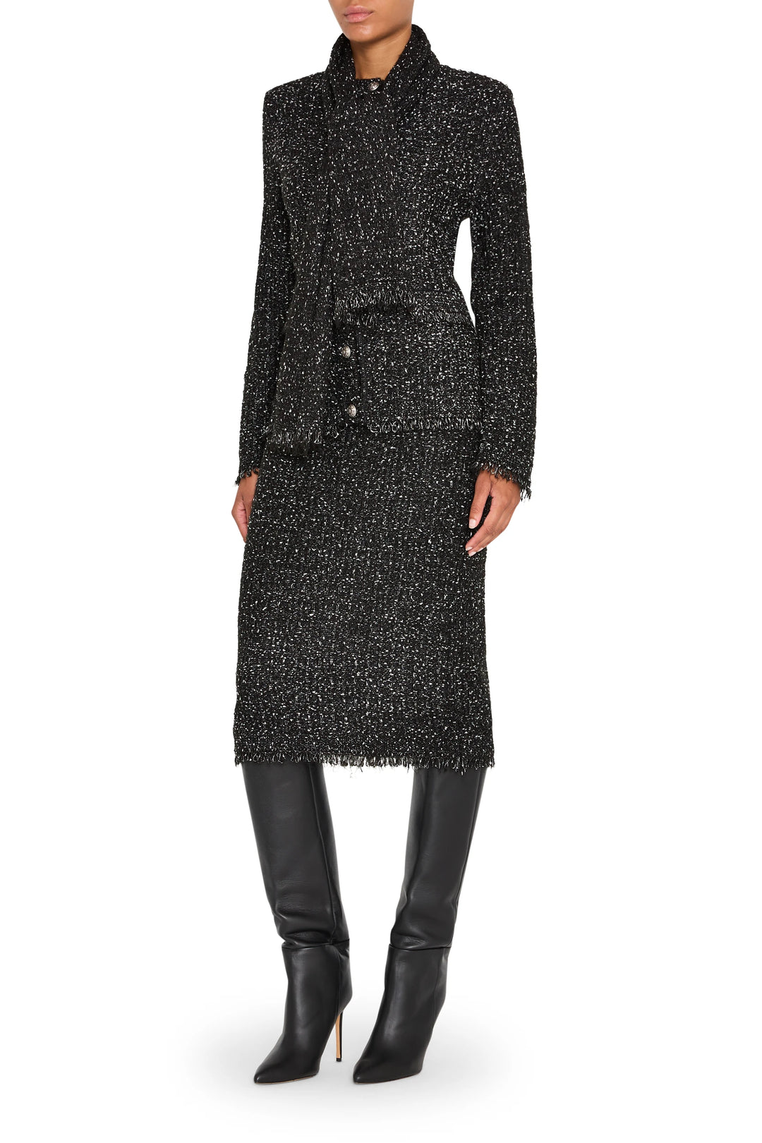 Longline cardigan with relaxed silhouette, tweed knit fabric, front patch pockets; front view on white.