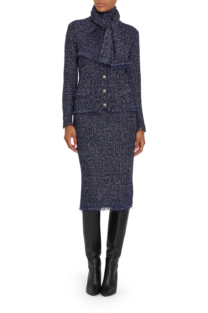 Tweed cardigan with fitted silhouette, button front closure, and ribbed trim; front view on model.