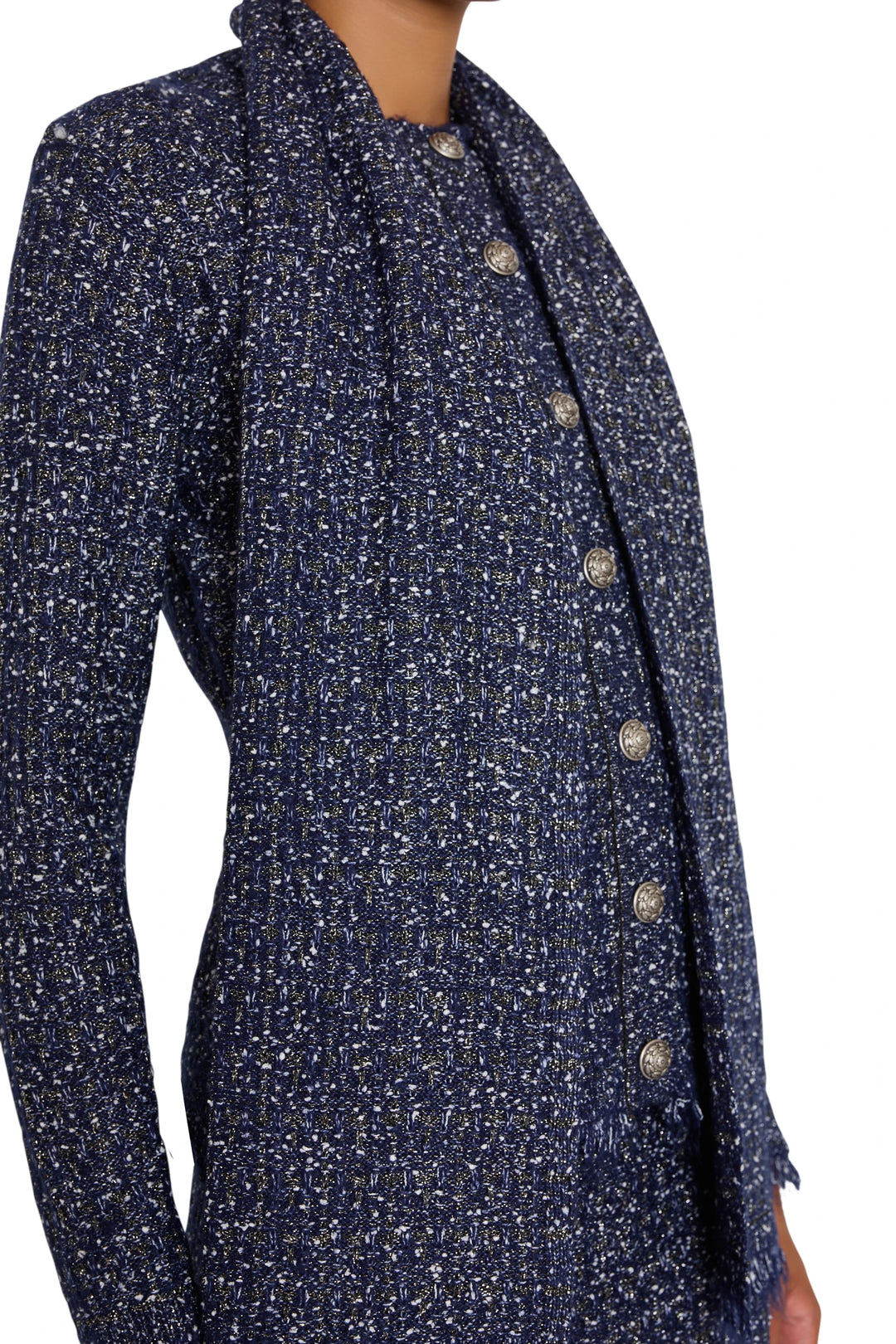 Tweed sweater cardigan with relaxed fit, silver buttons, and ribbed trim. Front view on model.