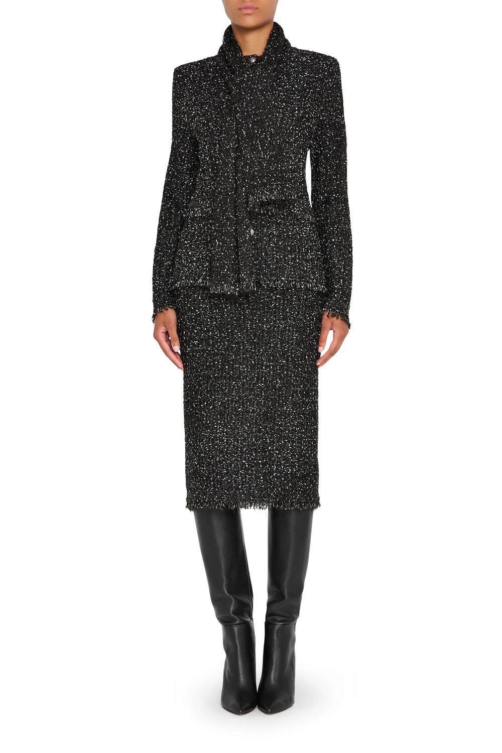 Straight silhouette tweed sweater skirt with ribbed waistband and hem, midi length; front view on model.