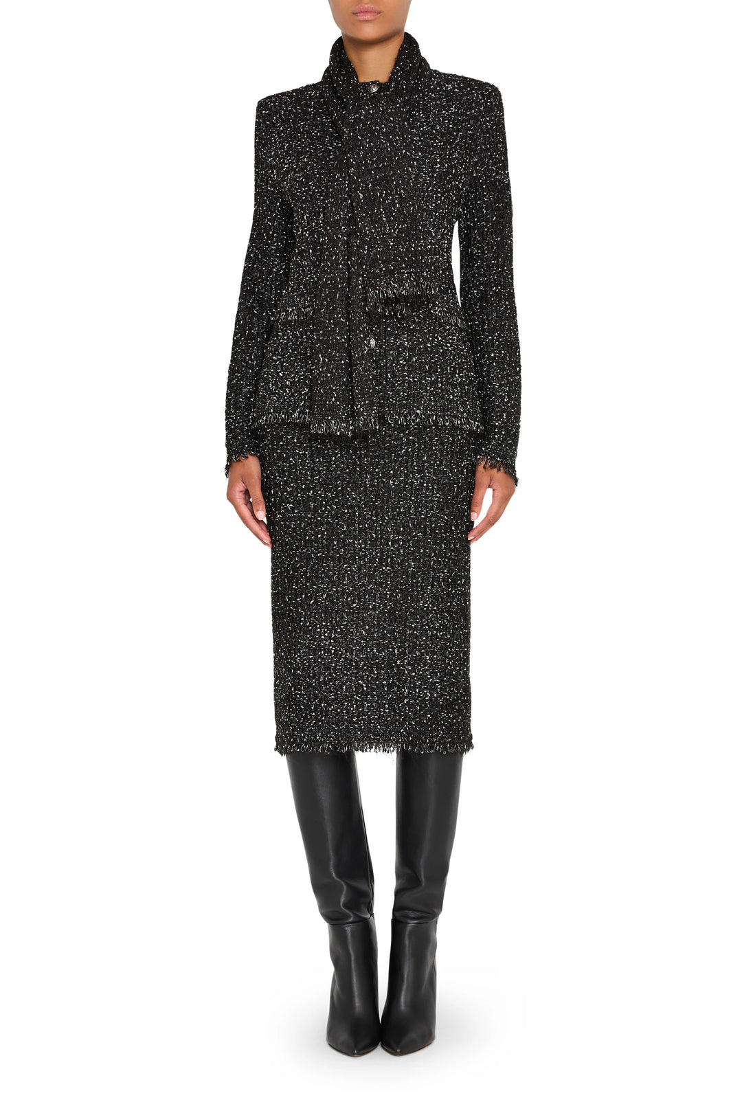 Straight silhouette tweed sweater skirt with ribbed waistband and hem, midi length; front view on model.