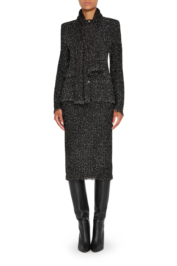 Straight silhouette tweed sweater skirt with ribbed waistband and hem, midi length; front view on model.