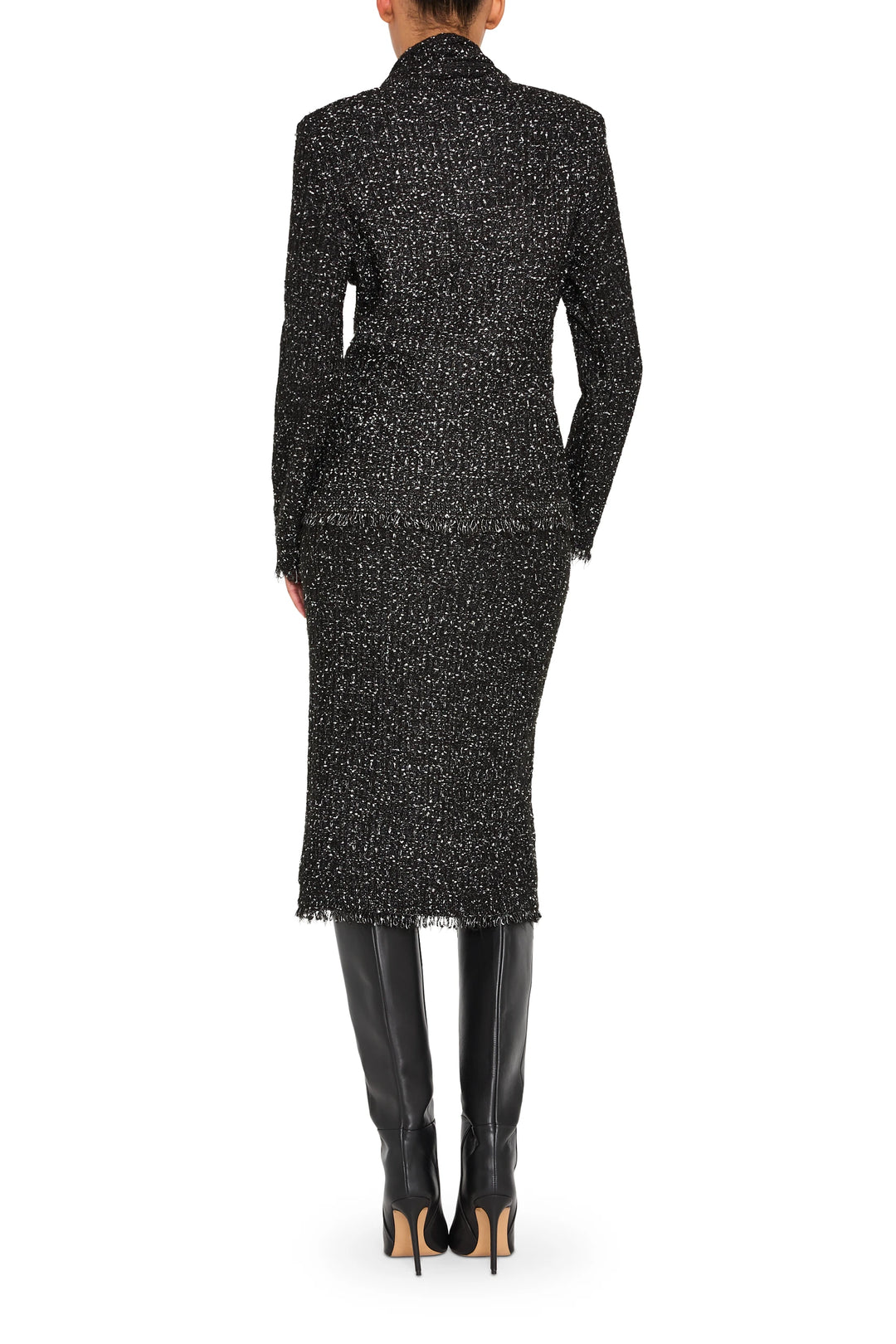 Straight, knee-length tweed skirt with clean waistband and subtle texture; back view on model.