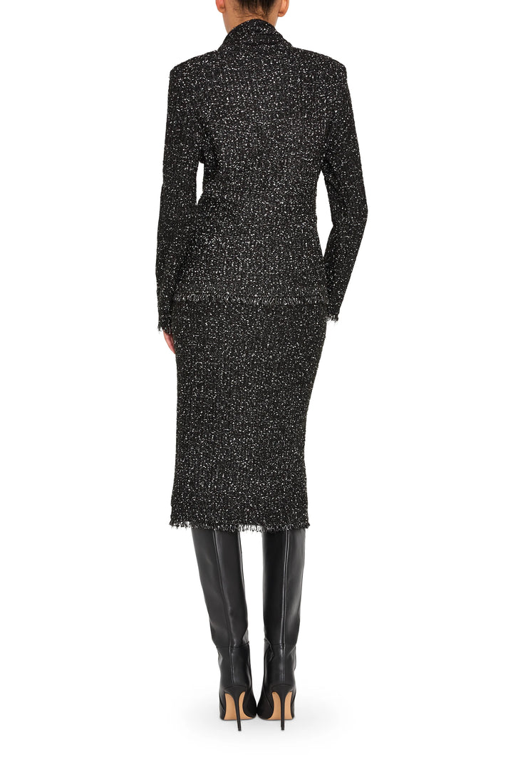 Straight, knee-length tweed skirt with clean waistband and subtle texture; back view on model.