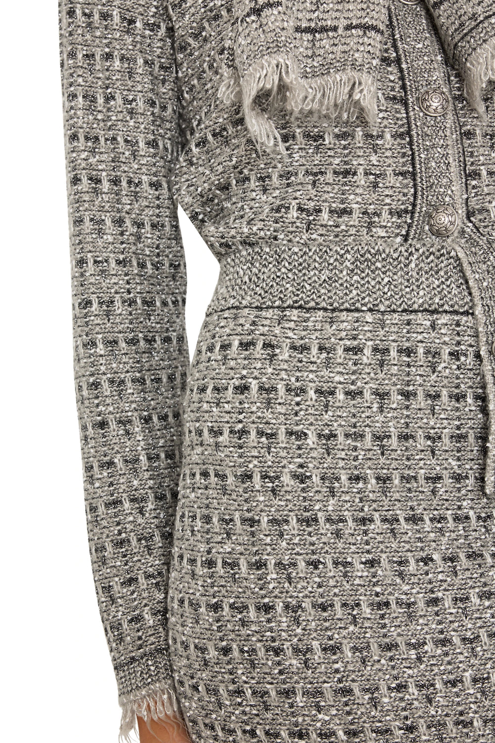 Textured knit with button detail and frayed hem of Juliette Tweed Sweater Skirt, detail view.