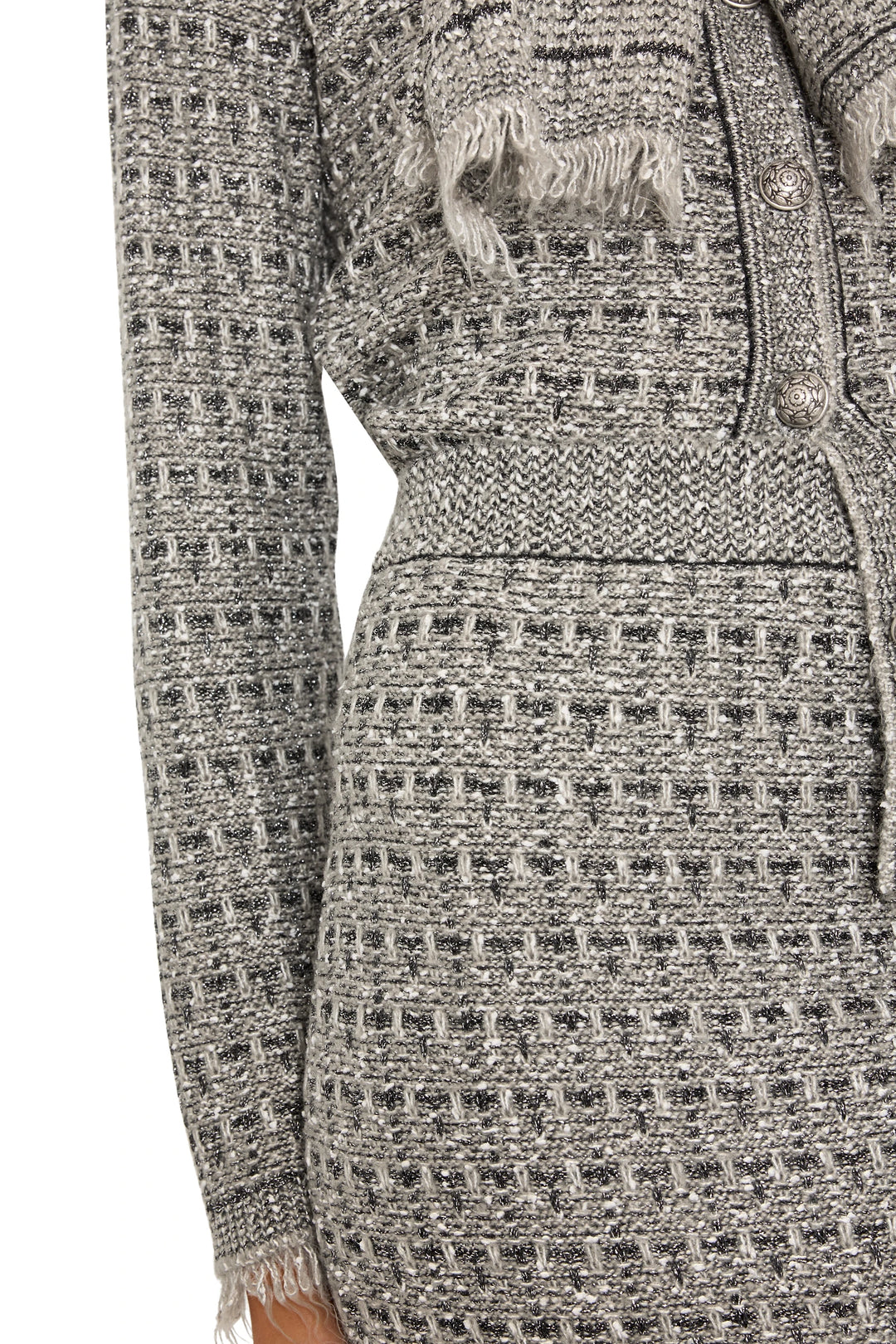 Textured knit with button detail and frayed hem of Juliette Tweed Sweater Skirt, detail view.