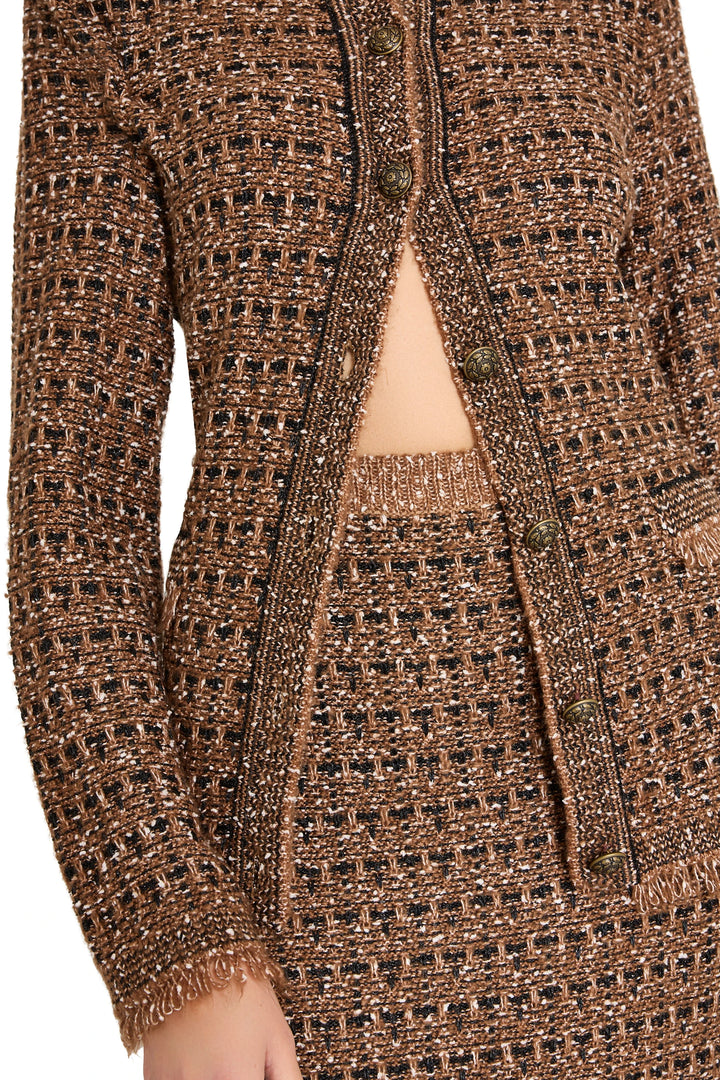 Tweed sweater skirt with gold buttons, fitted silhouette, rib knit waistband, detail view.