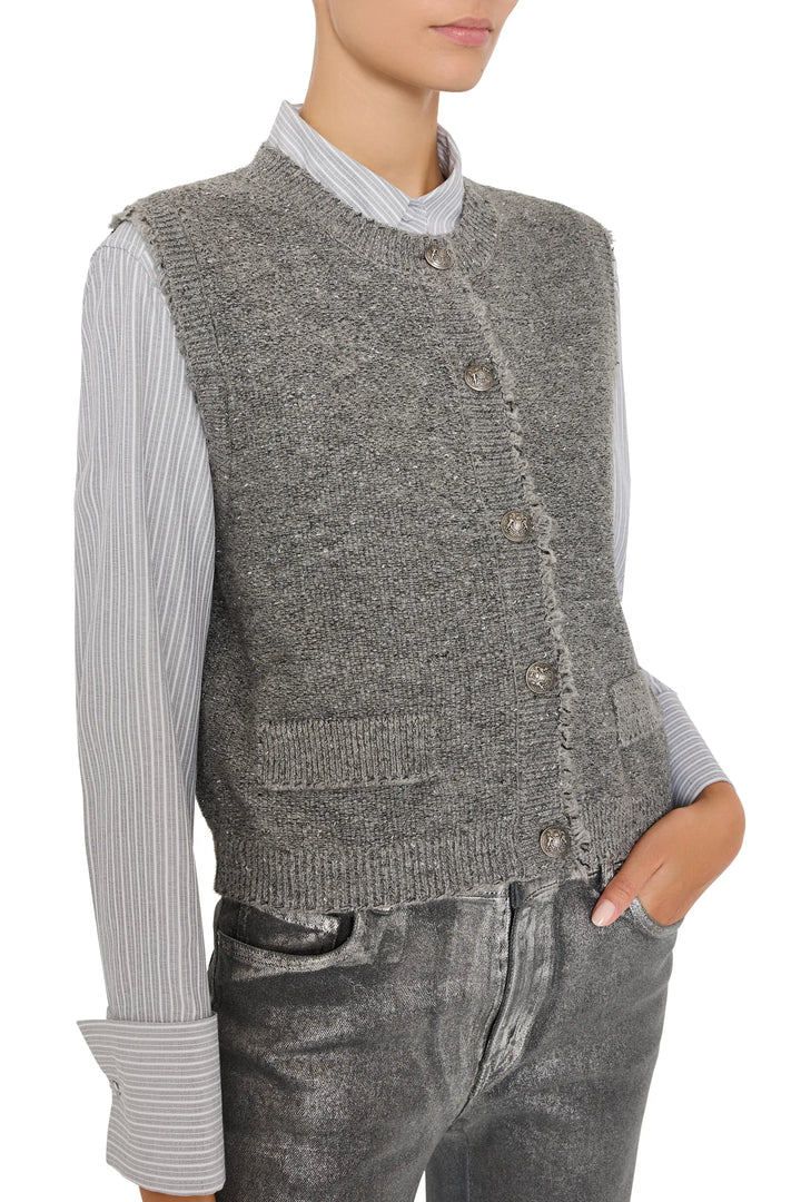 Sleeveless lurex sweater vest with classic V-neck and ribbed hem, slim fit. Front view on model.