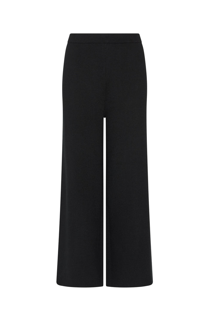 Wide-leg knit culottes in a fluid silhouette with subtle drape, elastic waistband; front view on white.