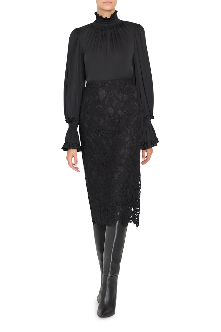 Simone Lace Skirt: black Italian corded lace midi pencil skirt with a scalloped hem, front view on model.