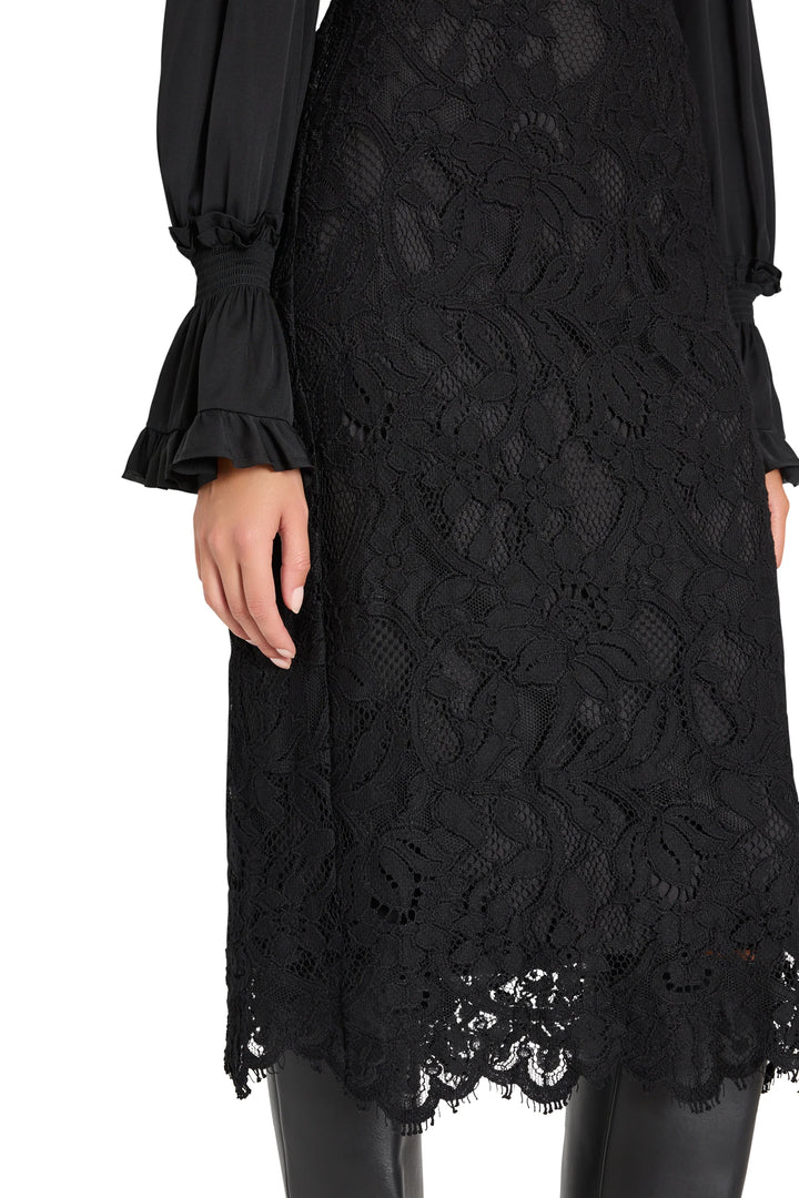 Simone Lace Skirt: a midi pencil skirt in Italian corded lace with a scalloped hem, front view on model.