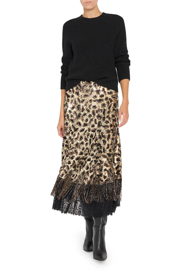 Maeve Sequin Skirt features a straight silhouette, beaded fringe detail, and sequin-embellished fabric; front view on model.