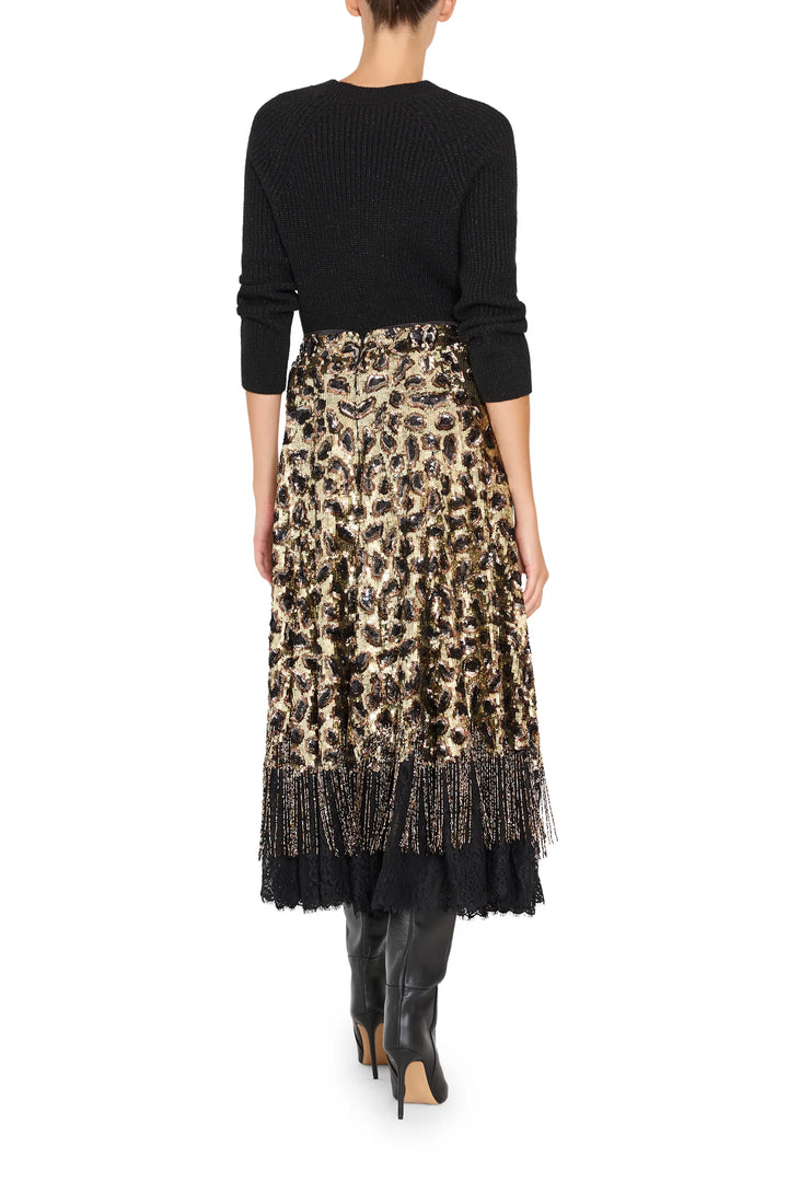 Back view: Maeve Sequin Skirt, straight silhouette, sequin-embellished fabric, midi length; back view on model.