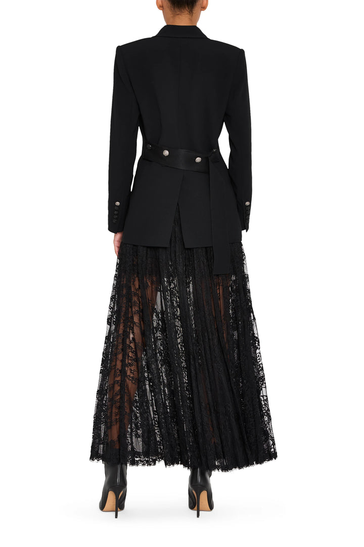 Long lace skirt with satin waistband, Chantilly lace overlay, floor-length, fluid silhouette; back view on model.
