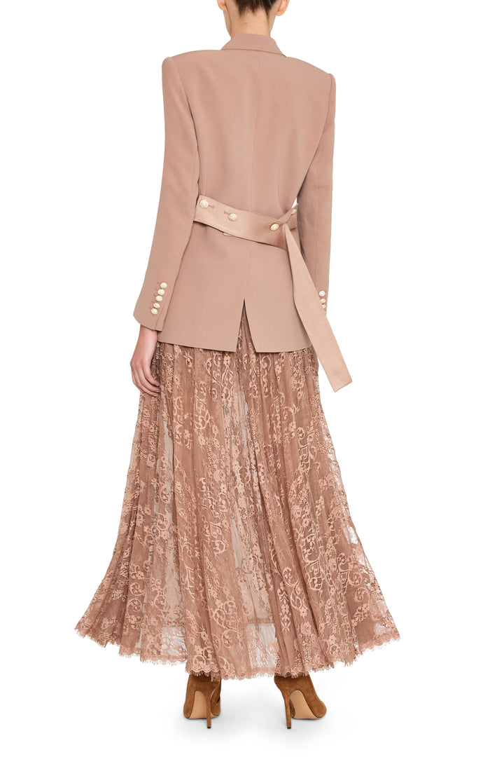 Long skirt in sheer Chantilly lace, softly flared silhouette, delicate floral pattern, back view on model.