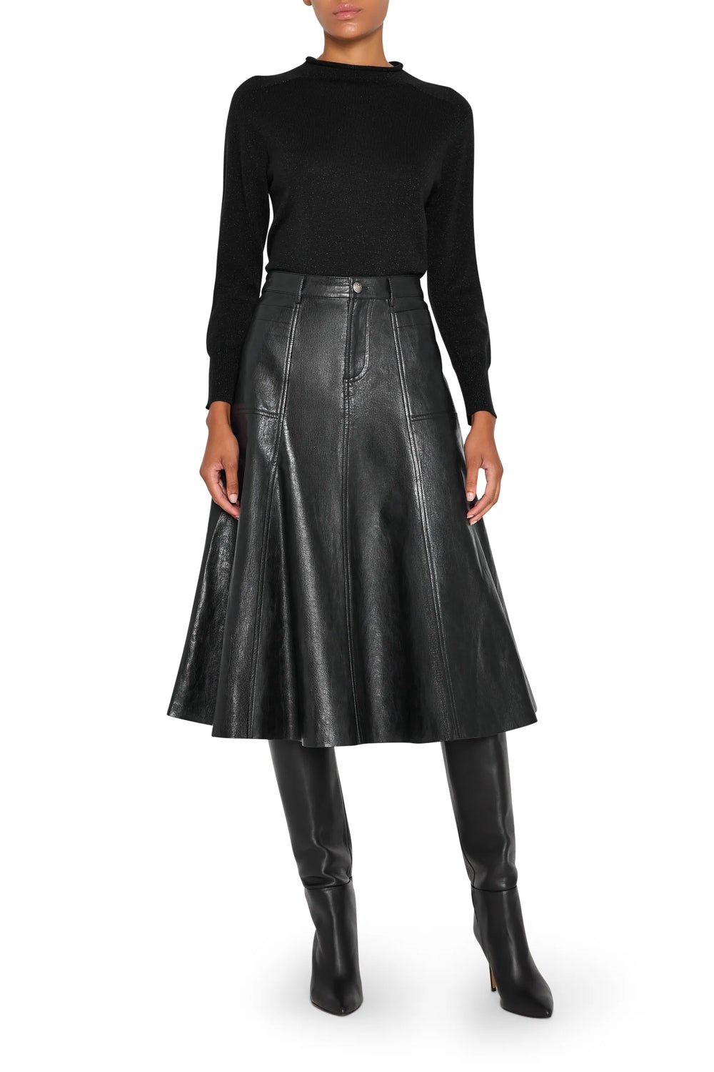 Vegan leather skirt with A-line silhouette and paneled construction, front view on model.
