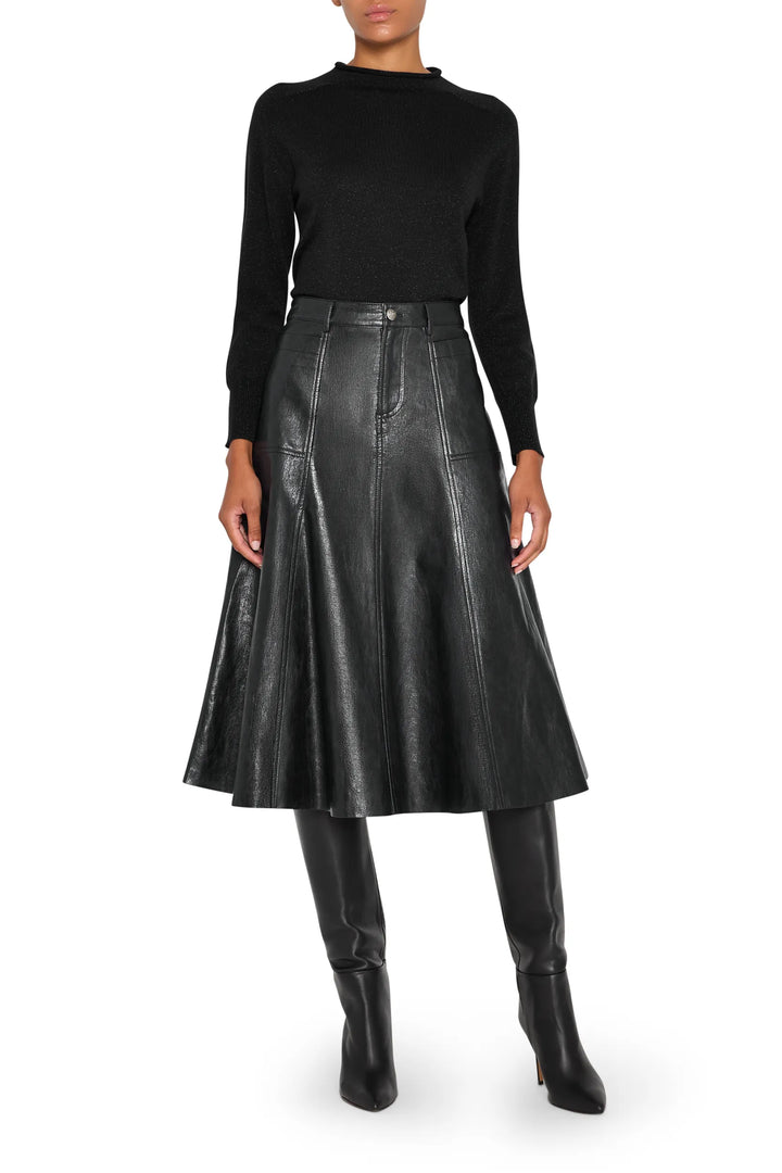 Vegan leather skirt with A-line silhouette and paneled construction, front view on model.