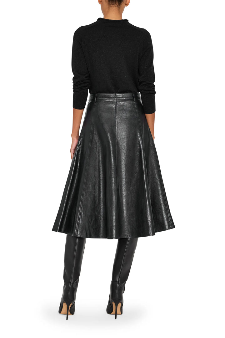 Vegan leather skirt with straight silhouette and clean waistband, knee-length hem; back view on model.