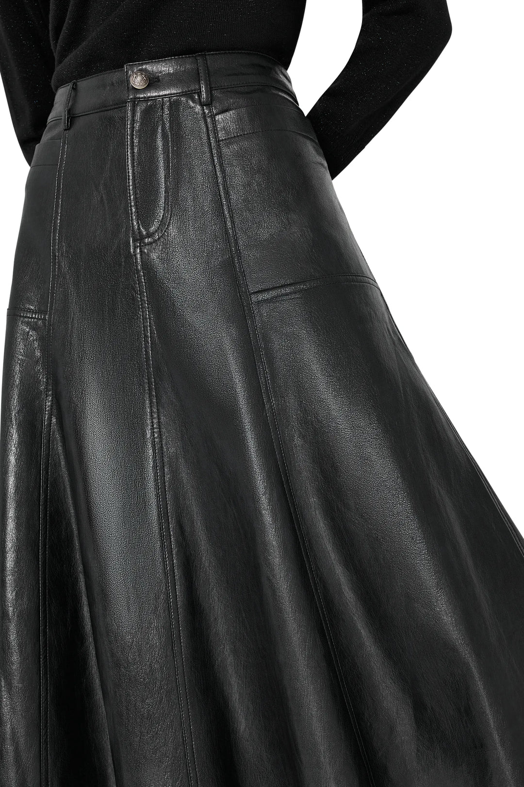 Vegan leather skirt with sleek midi silhouette, paneled construction. Front view on white.